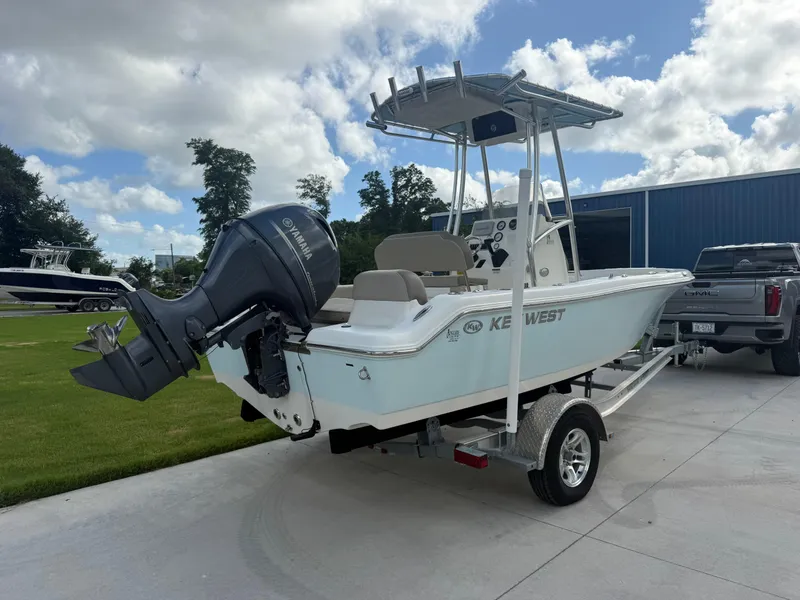 Slide: The Image of 2022 Key West 189FS boat on trailer with Yamaha outboard motor, parked outdoors. - 5