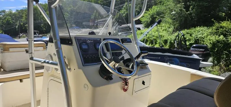 Slide: The Image of 2016 Scout 195 Sportfish boat interior with steering wheel and control panel. - 3