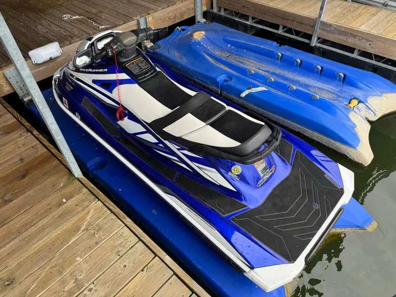 Slide: The Image of 2018 Yamaha WaveRunner GP1800R SVHO jet ski docked on wooden pier. - 2