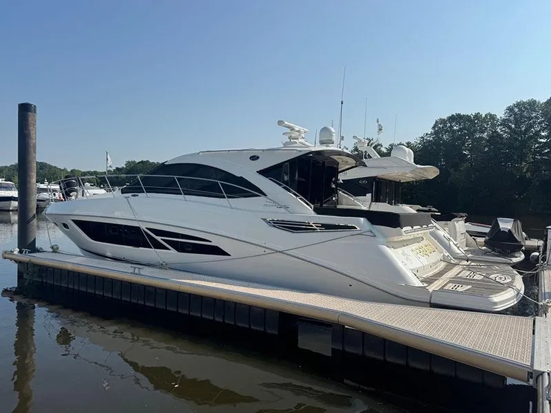 The Image of 2015 Sea Ray 510 Sundancer yacht docked at marina, side view. - 0