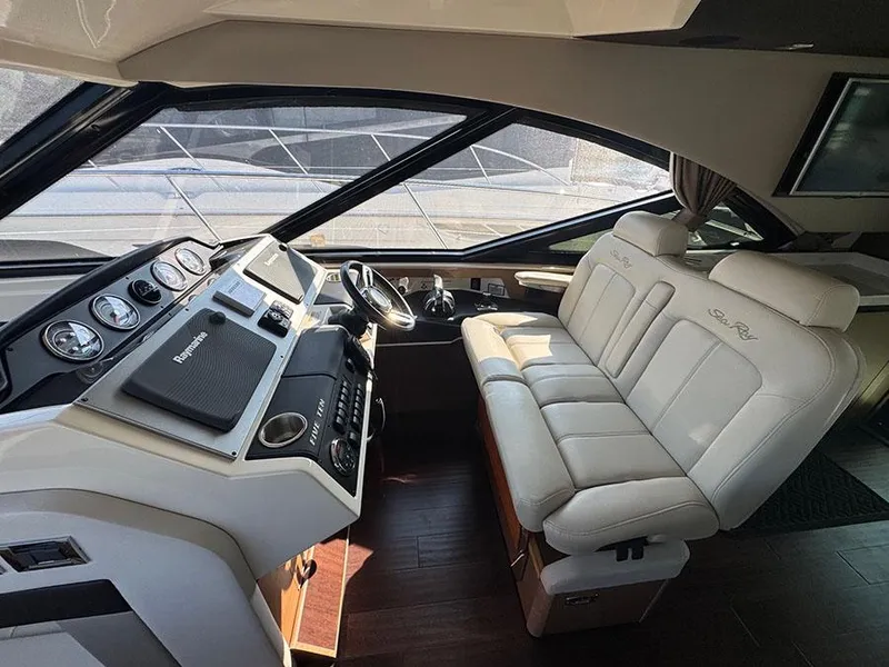Slide: The Image of Interior of 2015 Sea Ray 510 Sundancer yacht with luxurious helm and seating. - 13