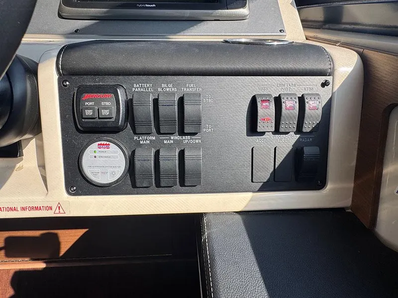 Slide: The Image of Control panel of a 2015 Sea Ray 510 Sundancer boat with various switches and indicators. - 17