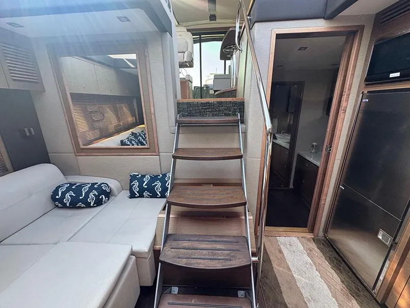 Slide: The Image of Luxurious interior of 2015 Sea Ray 510 Sundancer yacht with wooden stairs and modern furnishings. - 21