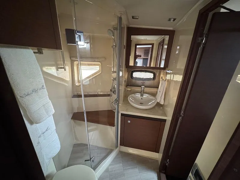 Slide: The Image of Luxurious bathroom in 2015 Sea Ray 510 Sundancer yacht with shower and sink. - 25