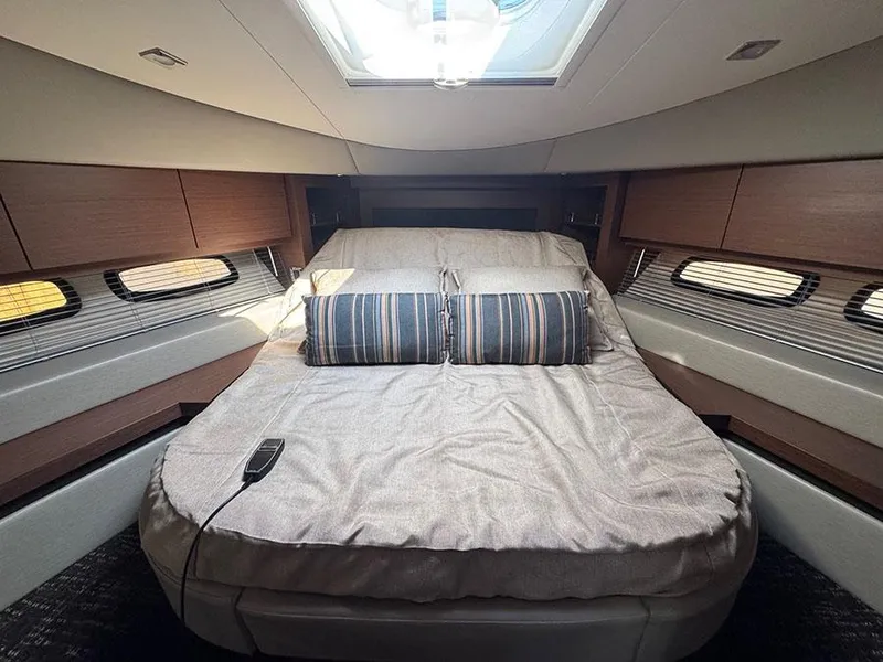 Slide: The Image of Luxurious cabin interior of 2015 Sea Ray 510 Sundancer yacht with cozy bed and skylight. - 26