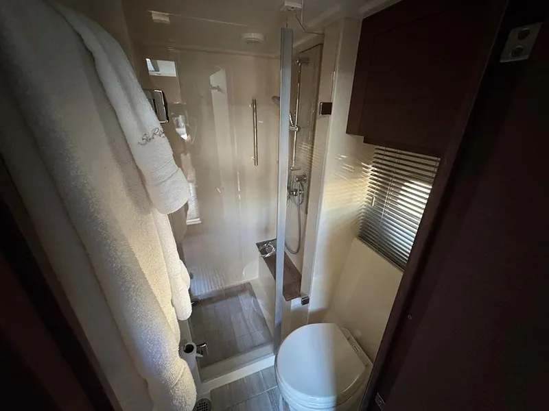 Slide: The Image of Luxurious bathroom in 2015 Sea Ray 510 Sundancer yacht with shower and toilet. - 34