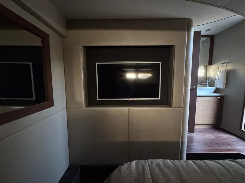 Slide: The Image of Interior of 2015 Sea Ray 510 Sundancer yacht with TV and bathroom view. - 38
