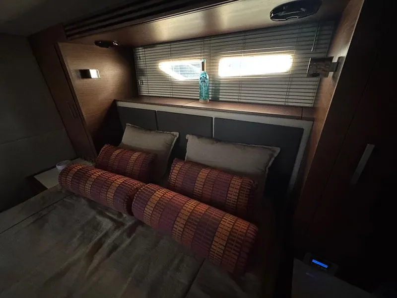 Slide: The Image of Luxurious cabin interior of 2015 Sea Ray 510 Sundancer yacht with cozy bedding. - 39