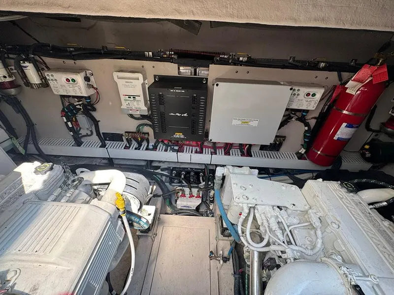 Slide: The Image of Engine room of 2015 Sea Ray 510 Sundancer, featuring mechanical and electrical components. - 48