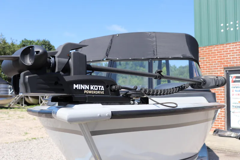 Slide: The Image of 2023 Starcraft Osprey 162 boat with Minn Kota PowerDrive motor, outdoor setting. - 3