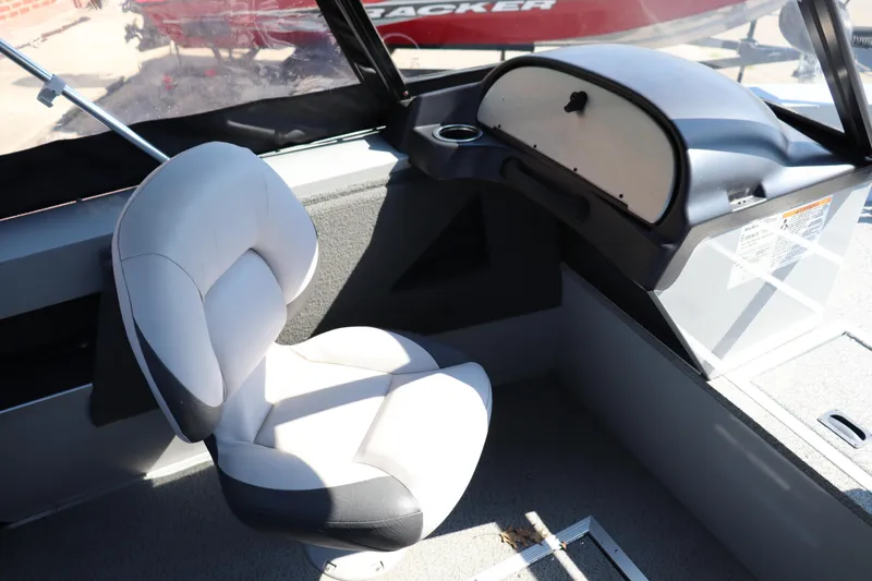Slide: The Image of Interior of 2023 Starcraft Osprey 162 boat with cushioned seat and dashboard. - 4