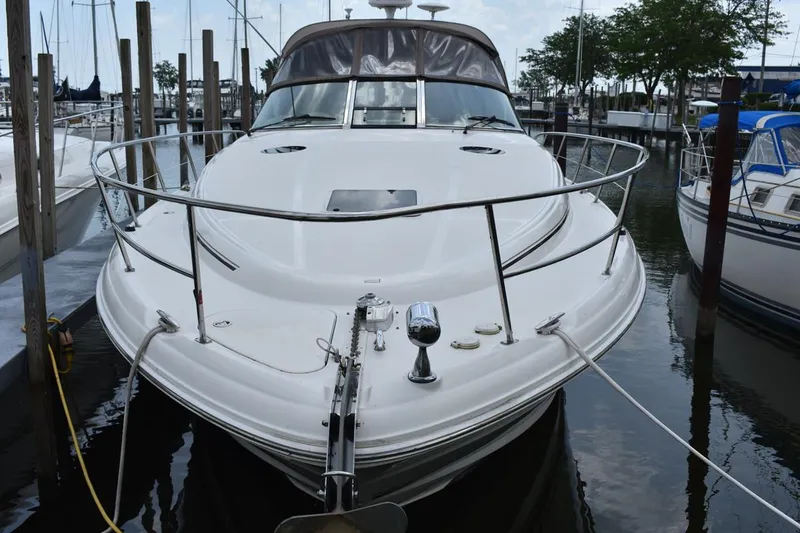 Slide: The Image of 2003 Sea Ray 360 Sundancer docked at marina, front view. - 1