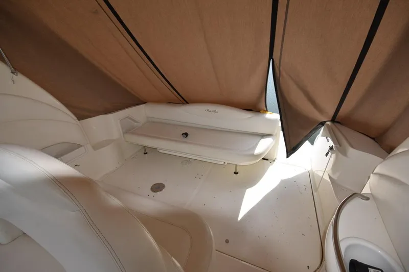 Slide: The Image of 2003 Sea Ray 360 Sundancer interior with beige seating and canopy. - 18