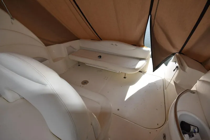 Slide: The Image of 2003 Sea Ray 360 Sundancer interior with beige seating and canopy. - 19
