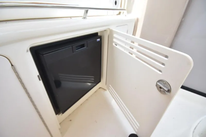 Slide: The Image of 2003 Sea Ray 360 Sundancer mini fridge with open cabinet door. - 20
