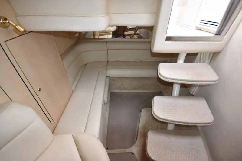 Slide: The Image of Interior of 2003 Sea Ray 360 Sundancer yacht with beige seating and stairs. - 27