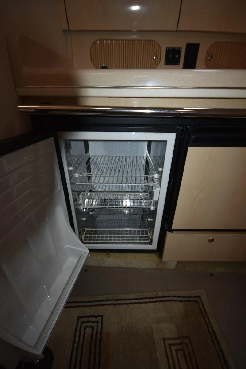Slide: The Image of Open refrigerator in 2003 Sea Ray 360 Sundancer yacht interior. - 32