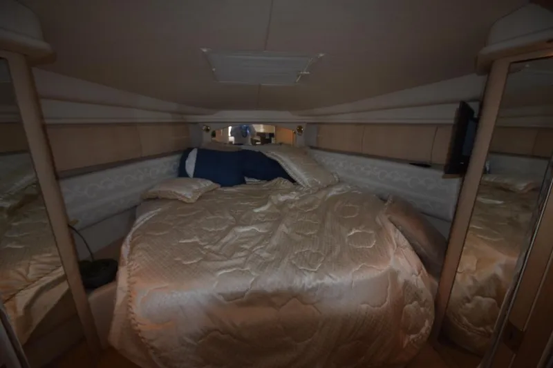 Slide: The Image of Luxurious cabin interior of 2003 Sea Ray 360 Sundancer yacht with cozy bedding. - 35