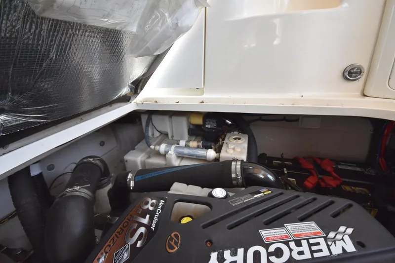 Slide: The Image of Engine compartment of 2003 Sea Ray 360 Sundancer with MerCruiser components visible. - 41