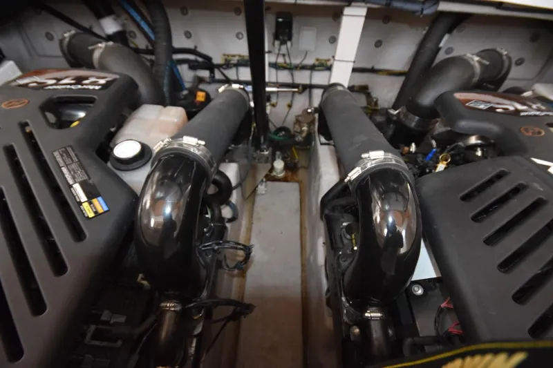Slide: The Image of Engine compartment of a 2003 Sea Ray 360 Sundancer boat, showcasing dual engines. - 42
