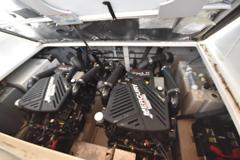 Slide: The Image of Engine compartment of 2003 Sea Ray 360 Sundancer with twin Mercury engines. - 43
