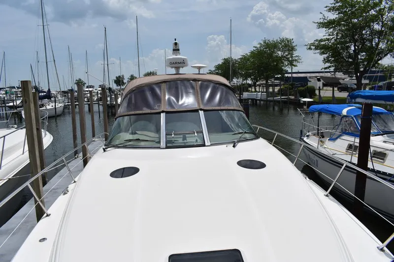 Slide: The Image of 2003 Sea Ray 360 Sundancer docked at marina, surrounded by sailboats. - 8