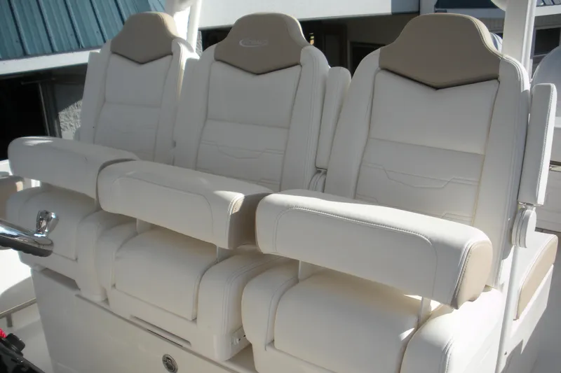 Slide: The Image of 2026 Robalo R300 Center Console boat seats, luxurious white leather design. - 14