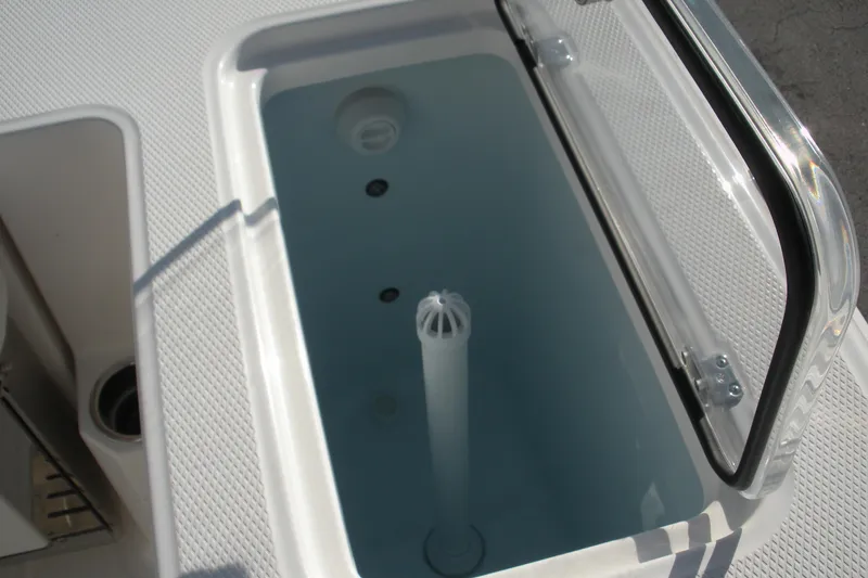 Slide: The Image of Livewell compartment on 2026 Robalo R300 Center Console boat. - 20