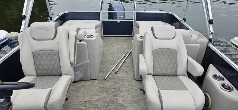 Slide: The Image of 2018 Bennington 22 SCWX pontoon boat interior with plush seating and cup holders. - 12