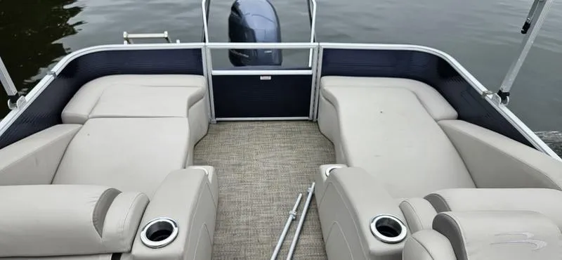 Slide: The Image of 2018 Bennington 22 SCWX pontoon boat interior with beige seating and cup holders. - 3