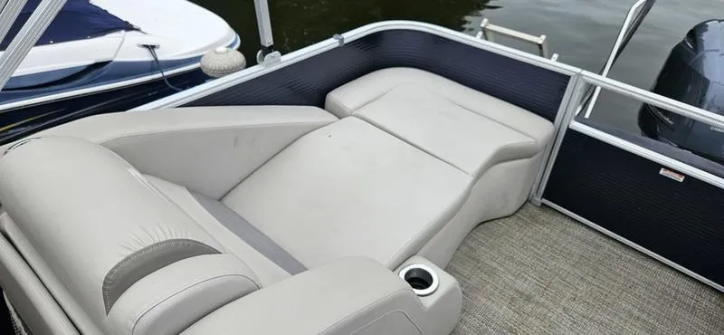 Slide: The Image of 2018 Bennington 22 SCWX boat interior with comfortable seating and cup holder. - 4