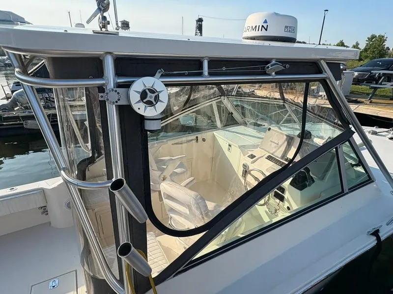 Slide: The Image of 2014 Carolina Classic 25 boat with Garmin radar, docked at marina. - 14