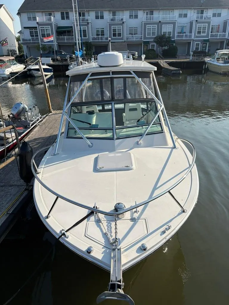 Slide: The Image of 2014 Carolina Classic 25 boat docked in marina, front view. - 5