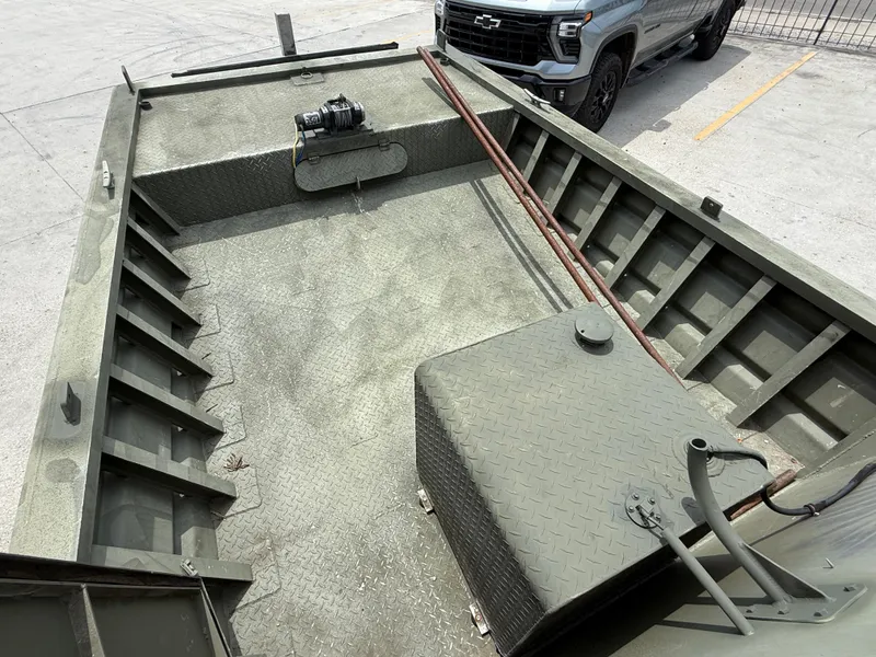 Slide: The Image of Custom Aluminum 2073 Cabin boat interior, 1995 model, with diamond plate flooring and winch. - 11