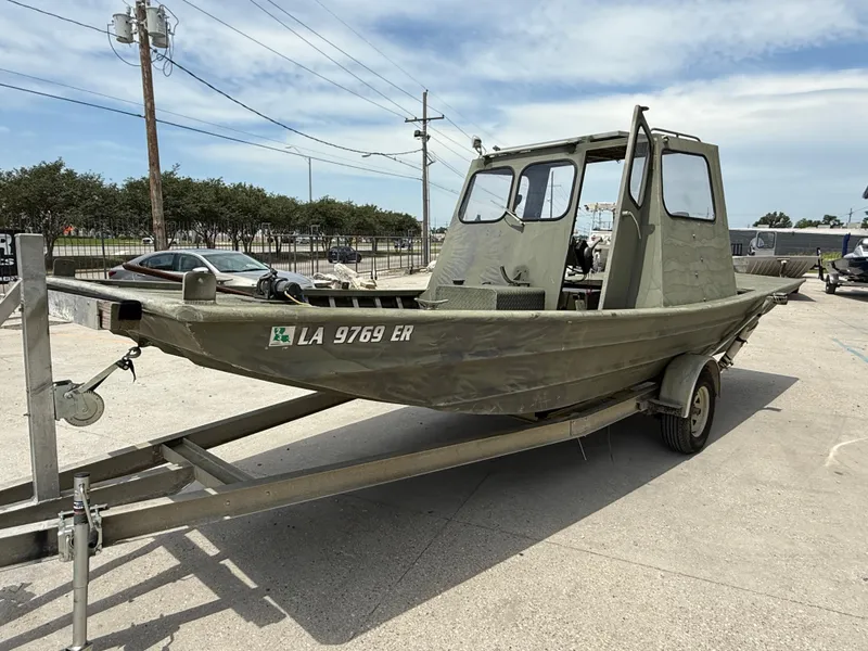 Slide: The Image of Custom 1995 Aluminum 2073 Cabin boat on trailer, parked outdoors. - 3