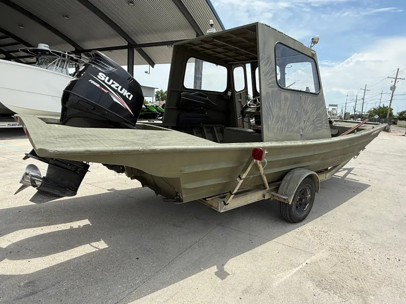 Slide: The Image of Custom 1995 Aluminum 2073 Cabin boat with Suzuki outboard motor on trailer. - 6