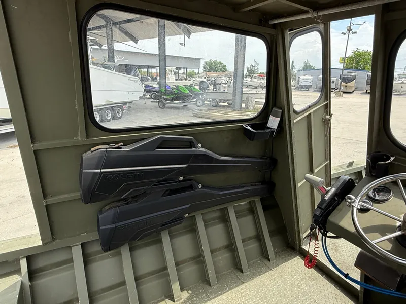 Slide: The Image of Interior of a 1995 Custom Aluminum 2073 Cabin boat with mounted storage cases. - 9