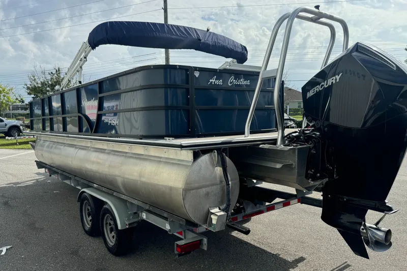 Slide: The Image of 2021 Bentley Pontoons 243 FISH 4PT on trailer with Mercury outboard motor. - 14