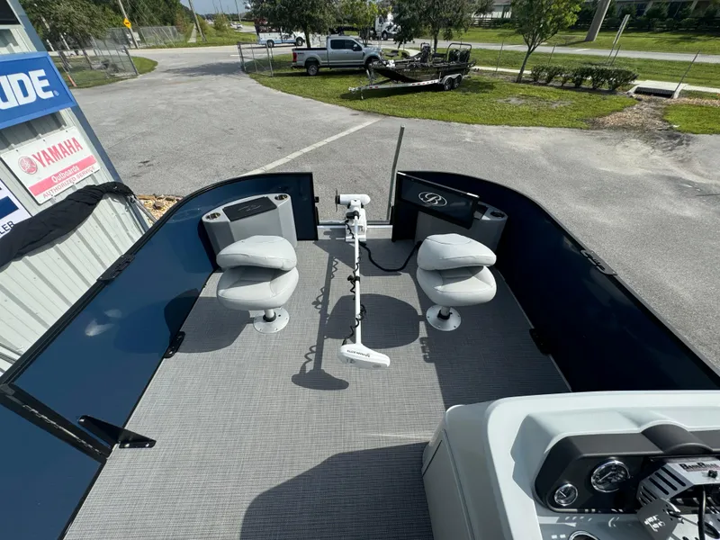 Slide: The Image of 2021 Bentley Pontoons 243 FISH 4PT interior with fishing seats and equipment. - 7