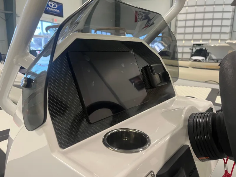 Slide: The Image of 2026 Highfield Velox 420 dashboard with touchscreen and cup holder in a showroom setting. - 10