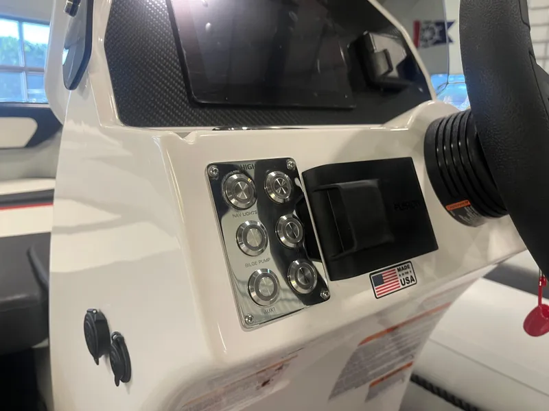 Slide: The Image of Control panel of 2026 Highfield Velox 420 boat with navigation and bilge pump switches. - 11