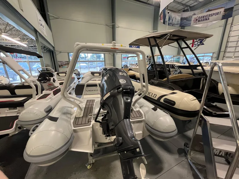 Slide: The Image of 2026 Highfield Velox 420 boat with Yamaha engine displayed at Danversport Marina showroom. - 17