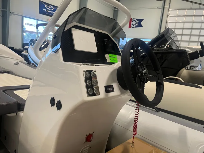 Slide: The Image of 2026 Highfield Velox 420 boat console with steering wheel and control panel. - 19