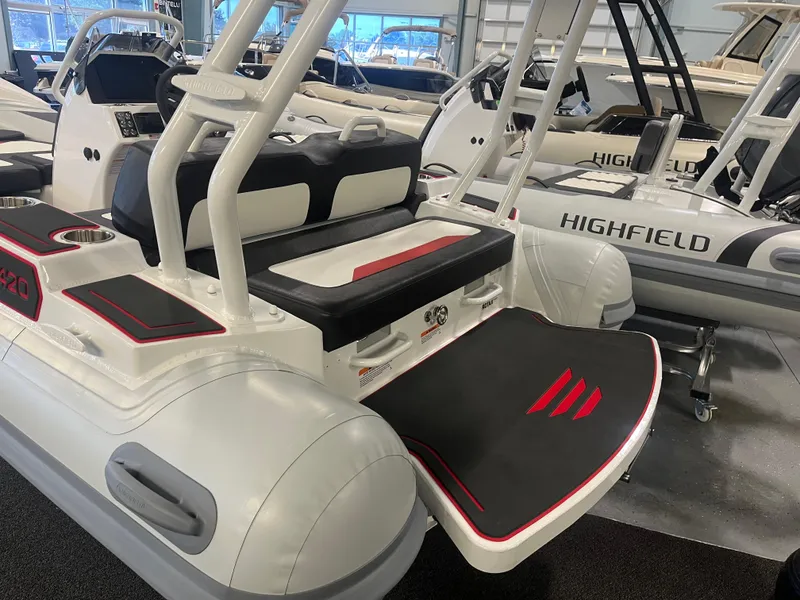 Slide: The Image of 2026 Highfield Velox 420 inflatable boat with sleek design and modern features in showroom. - 6
