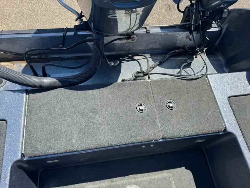 Slide: The Image of 2005 Skeeter ZX 2050 boat interior with Yamaha engine and storage compartments. - 10