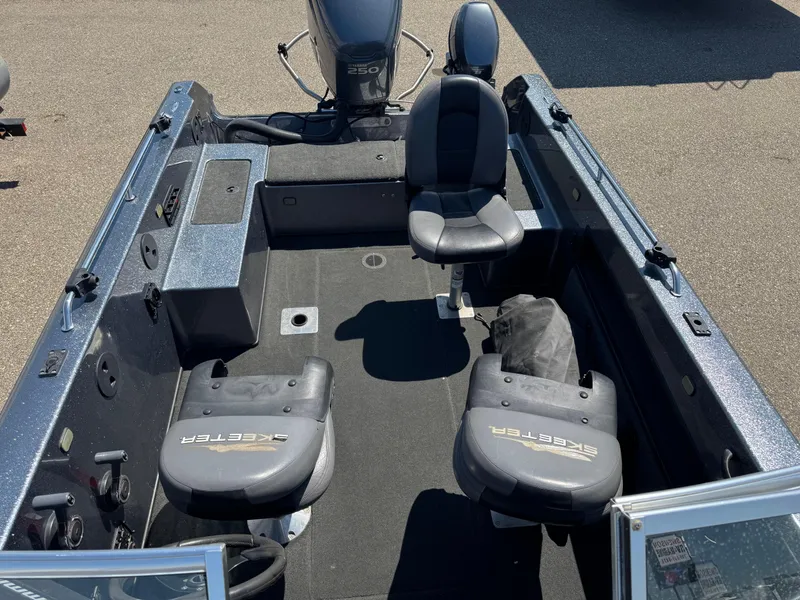 Slide: The Image of 2005 Skeeter ZX 2050 boat interior with seating and Yamaha 250 engine. - 16