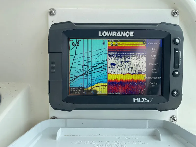 Slide: The Image of Lowrance HDS7 fishfinder on 2002 Wellcraft 330 Coastal boat, displaying sonar and navigation data. - 19