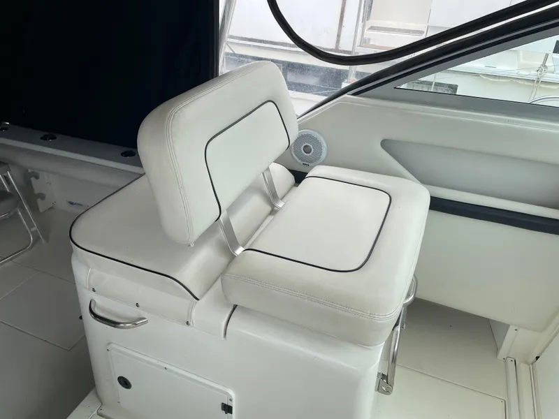 Slide: The Image of White cushioned seat on 2002 Wellcraft 330 Coastal boat interior. - 21