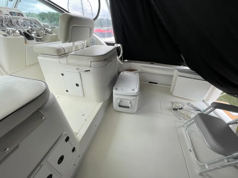 Slide: The Image of Interior of a 2002 Wellcraft 330 Coastal boat with white seating and controls. - 22