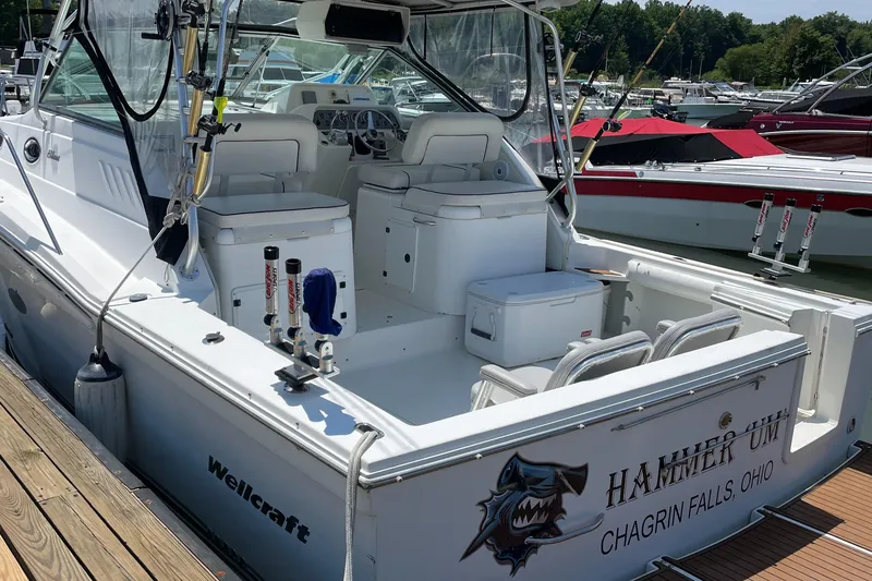 Slide: The Image of 2002 Wellcraft 330 Coastal boat docked, featuring fishing gear and seating, Chagrin Falls, Ohio. - 7